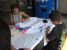 A girl and boy enjoying color time with t-shirts