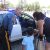 A picture of a New Jersey state trooper offering to let a child sit in his police car