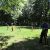 A picture of a state trooper playing Frisbee with children