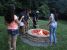 A picture of guests toasting their s'mores by the firepit